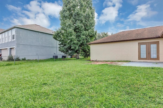 view of yard with a patio and french doors