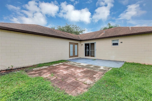 exterior space featuring a patio and a lawn