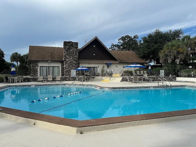 view of swimming pool with a patio area