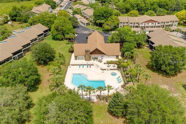 birds eye view of property with a residential view