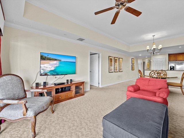 living area featuring a raised ceiling, visible vents, crown molding, light colored carpet, and ceiling fan with notable chandelier
