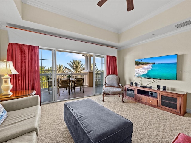 carpeted living room featuring ceiling fan and crown molding