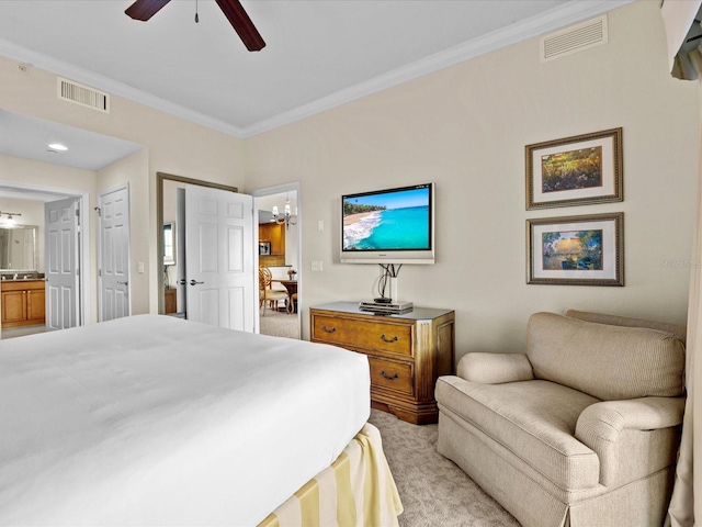 bedroom with connected bathroom, ornamental molding, light carpet, and ceiling fan