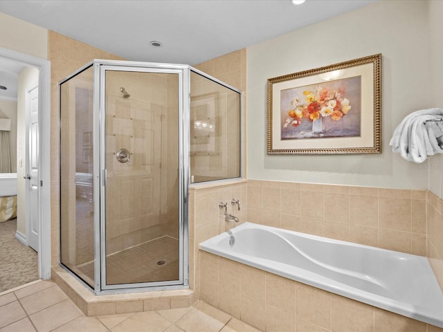 bathroom featuring independent shower and bath and tile patterned flooring