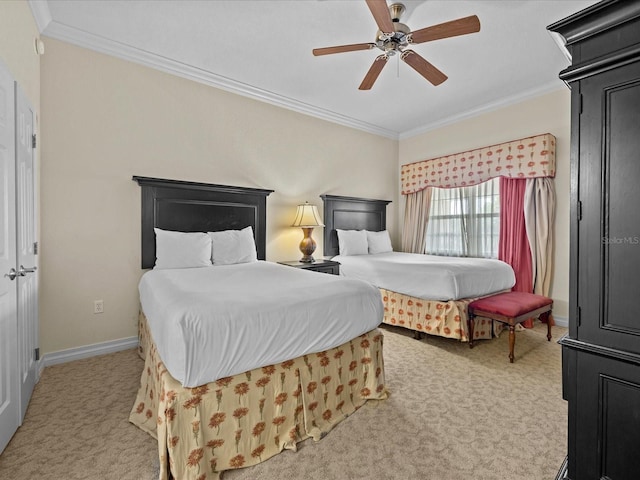 carpeted bedroom with ceiling fan and crown molding