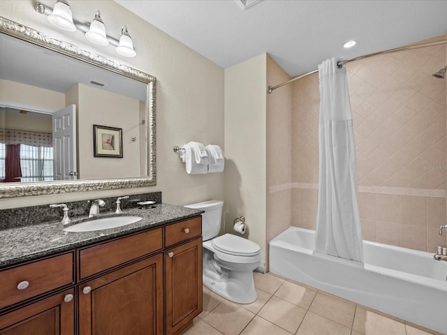 full bathroom featuring shower / bath combination with curtain, tile patterned floors, vanity, and toilet