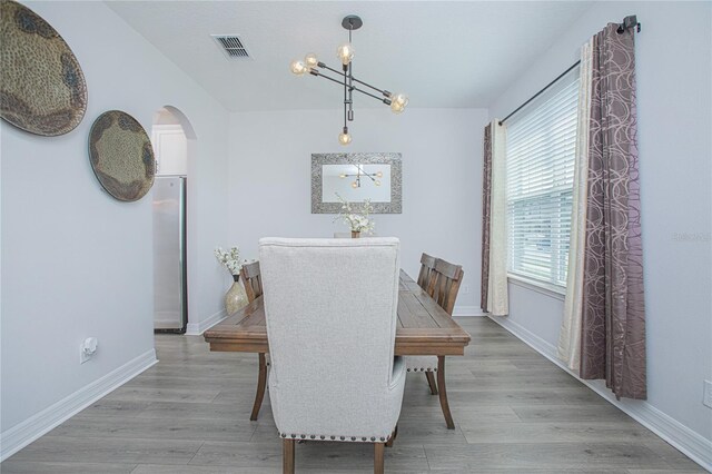 dining space featuring light wood-type flooring