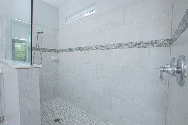 bathroom with a tile shower