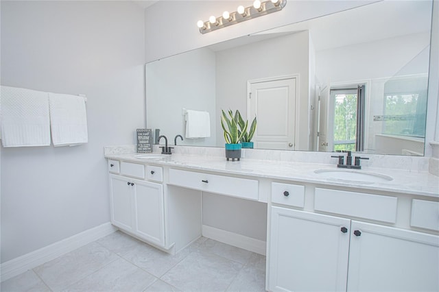 bathroom with tile patterned flooring and vanity