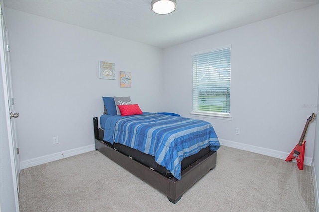 bedroom with light carpet