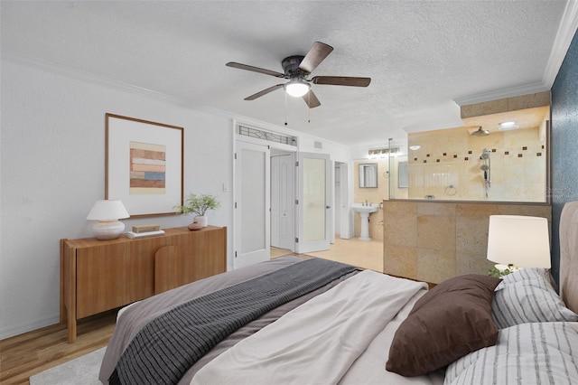 bedroom featuring ceiling fan, a textured ceiling, light hardwood / wood-style flooring, and ornamental molding