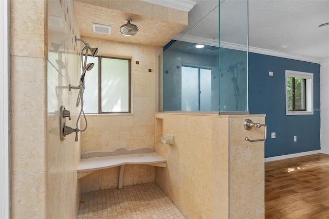 bathroom featuring wood-type flooring, a shower, tile walls, and ornamental molding