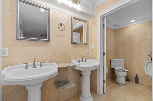 bathroom featuring tile walls, crown molding, and toilet