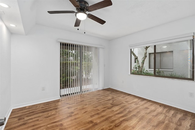 unfurnished room featuring hardwood / wood-style floors and ceiling fan