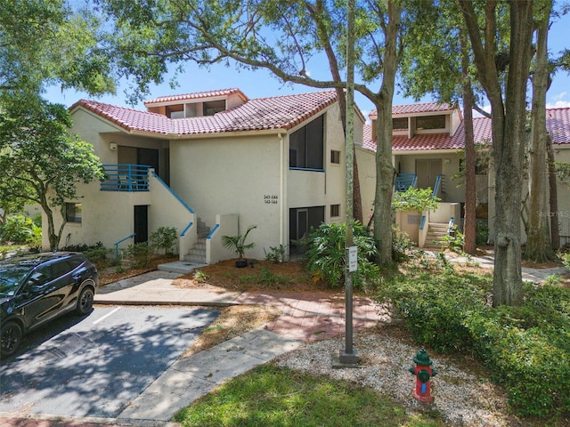 view of front of house featuring a balcony