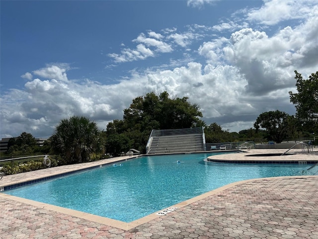 view of swimming pool with a patio area