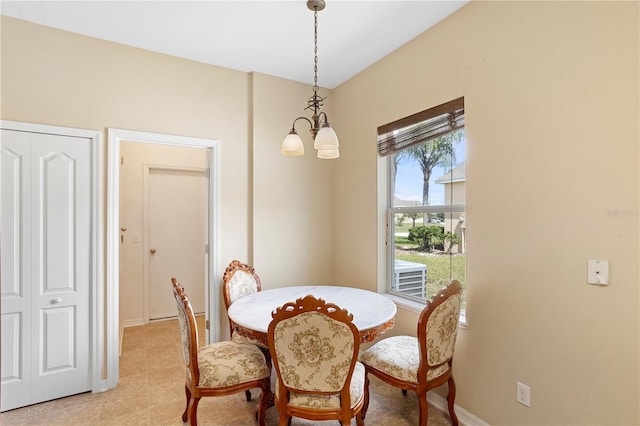 dining area featuring a chandelier