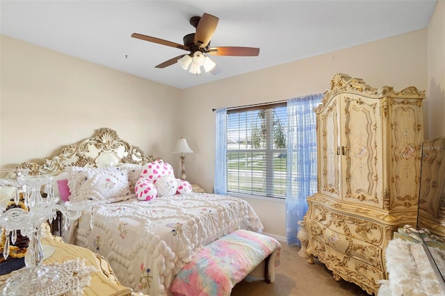 bedroom with ceiling fan and light carpet