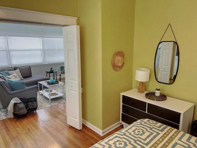 bedroom with hardwood / wood-style floors