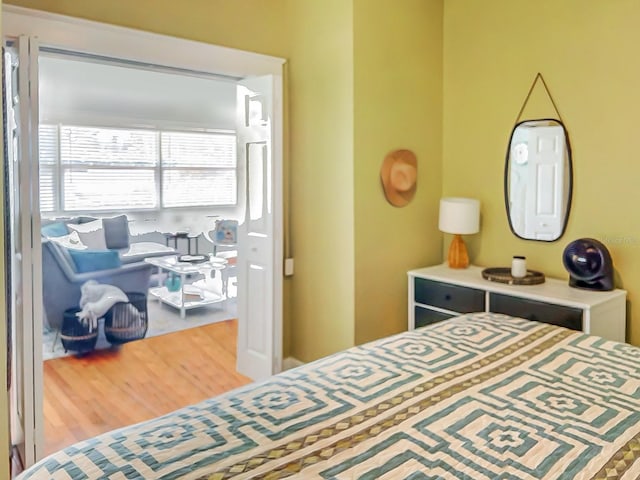 bedroom with wood-type flooring