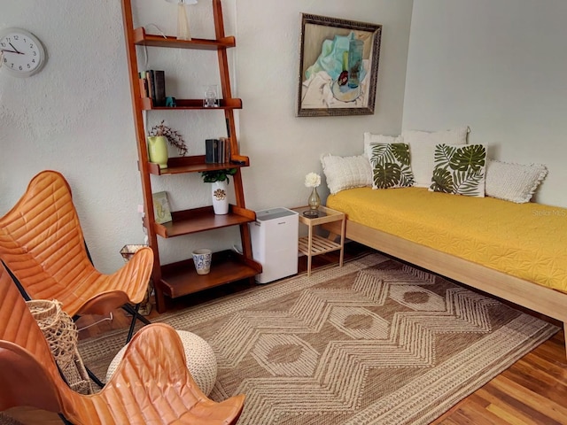 sitting room featuring hardwood / wood-style flooring