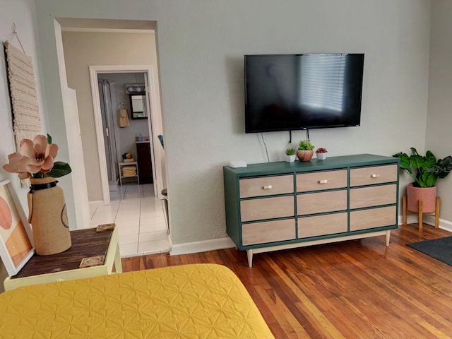 bedroom with hardwood / wood-style flooring