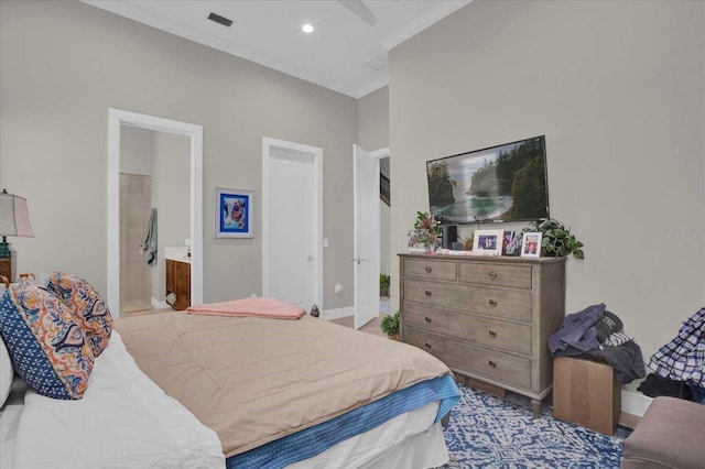 bedroom with connected bathroom, ornamental molding, and ceiling fan