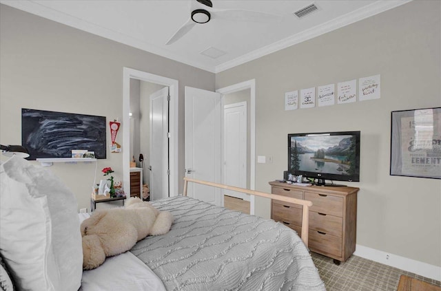 carpeted bedroom with ceiling fan and crown molding