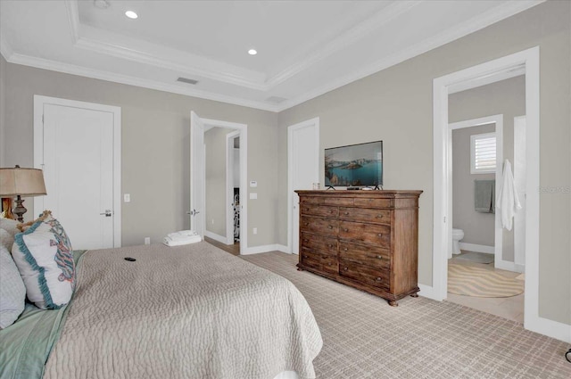 bedroom featuring light carpet, a raised ceiling, connected bathroom, and ornamental molding