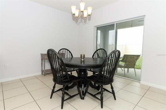 tiled dining area with a notable chandelier and a healthy amount of sunlight