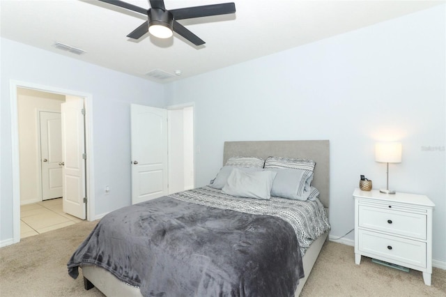 bedroom with light carpet and ceiling fan