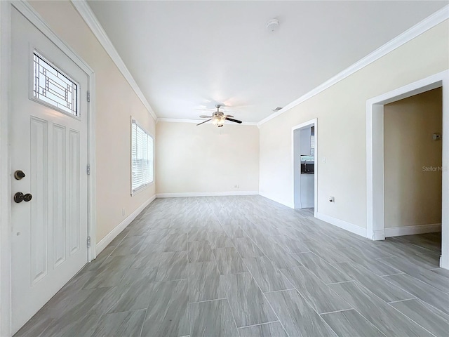 interior space featuring baseboards, crown molding, light wood-style floors, and a ceiling fan