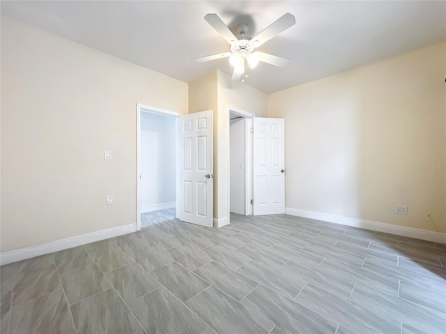 unfurnished bedroom featuring baseboards and ceiling fan