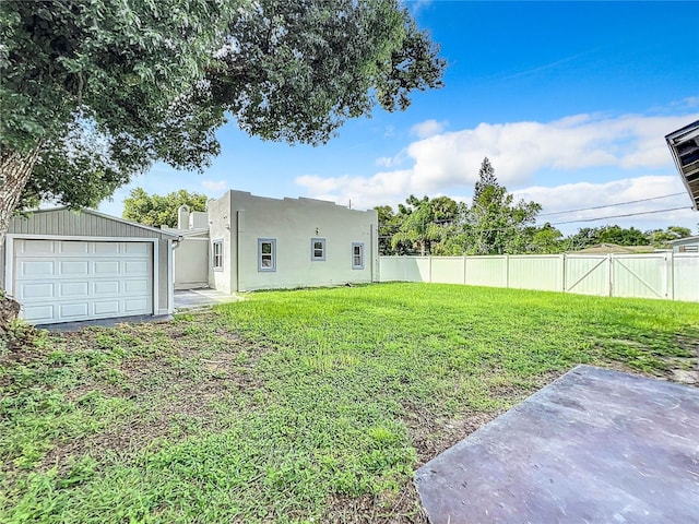 view of yard featuring a garage