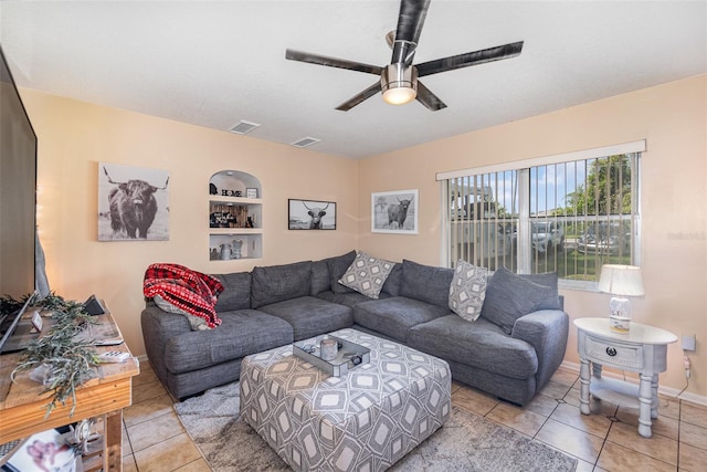 living room with light tile patterned floors and ceiling fan