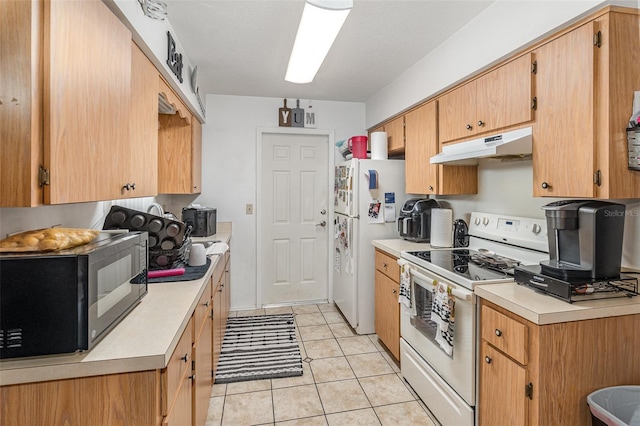 kitchen featuring white appliances and light tile patterned floors