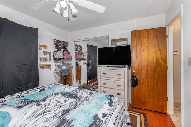 bedroom featuring a closet, ceiling fan, and hardwood / wood-style floors