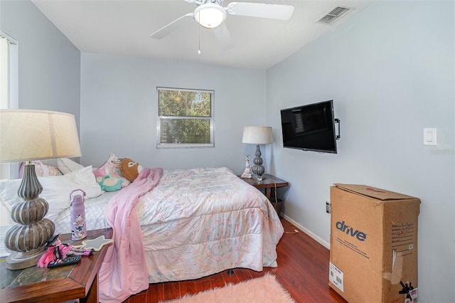 bedroom featuring ceiling fan and dark wood-type flooring