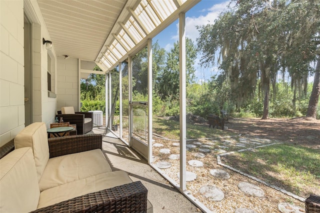 sunroom featuring lofted ceiling