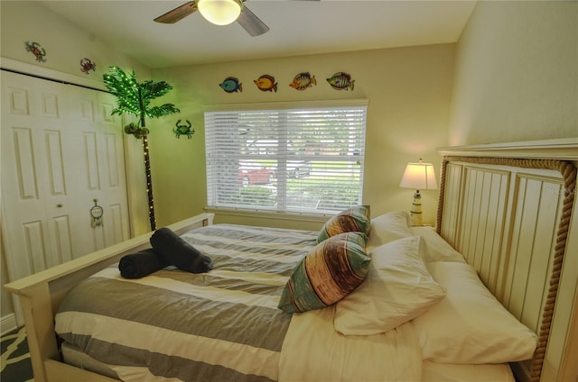 bedroom with ceiling fan and a closet