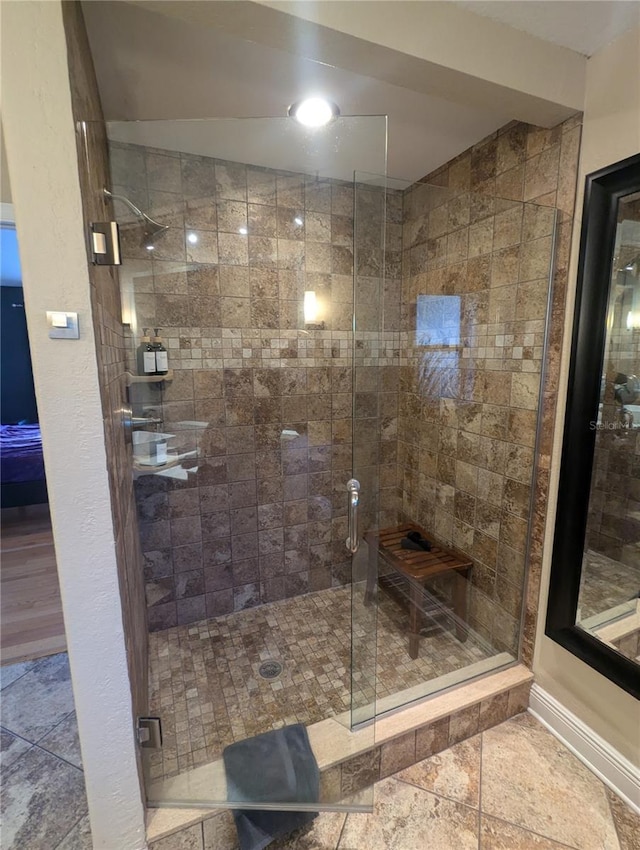 bathroom with a shower stall