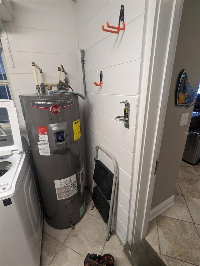 utility room featuring washer / dryer and water heater