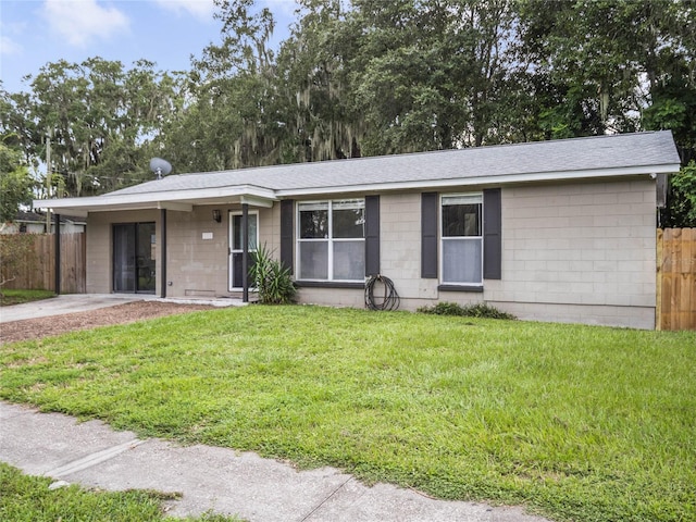 ranch-style home with a front yard