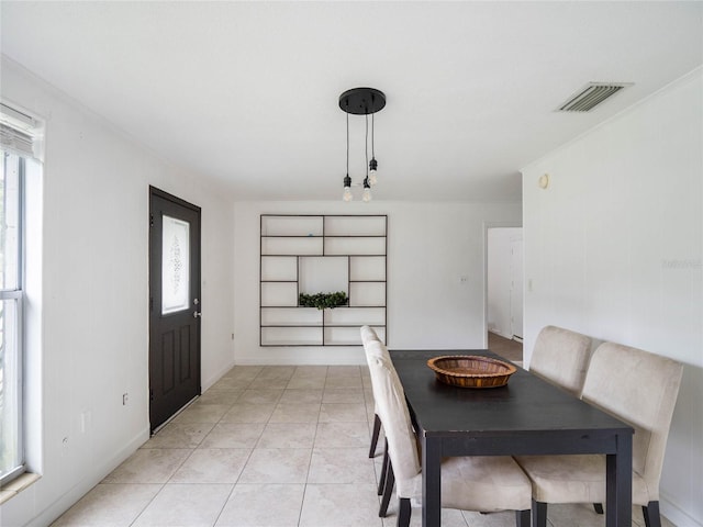 dining space with light tile patterned floors