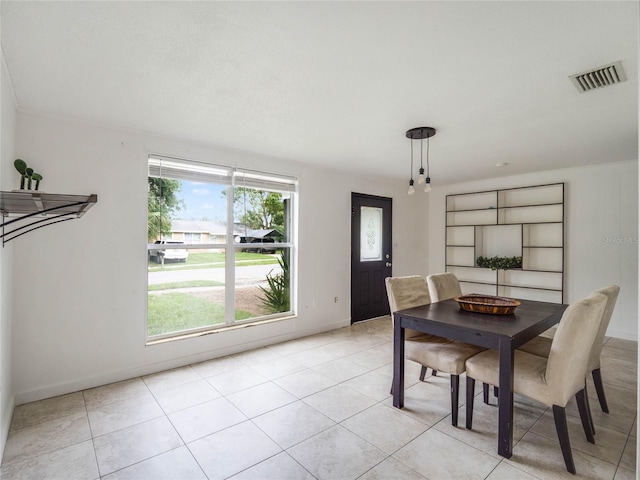 dining area featuring light tile patterned floors