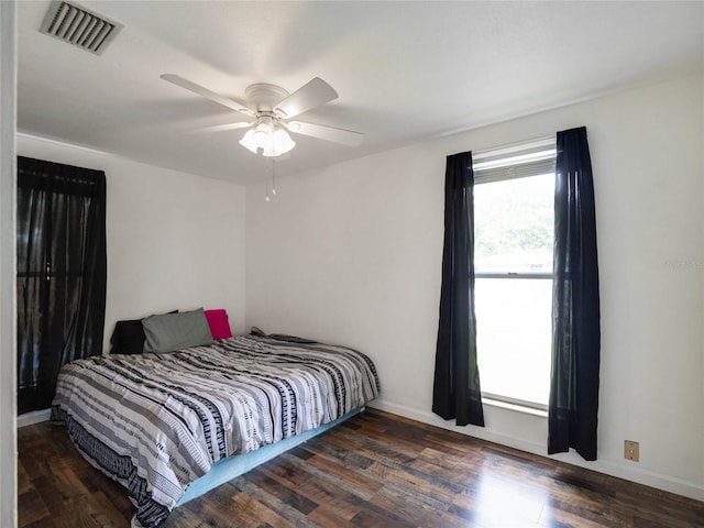 bedroom featuring ceiling fan and dark hardwood / wood-style flooring