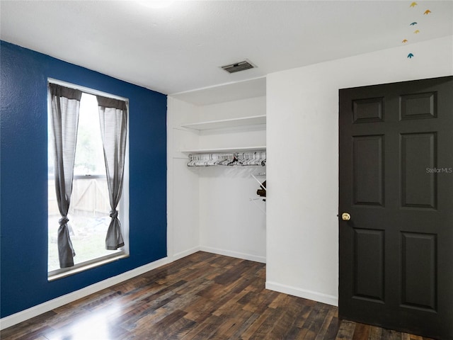 foyer with dark wood-type flooring