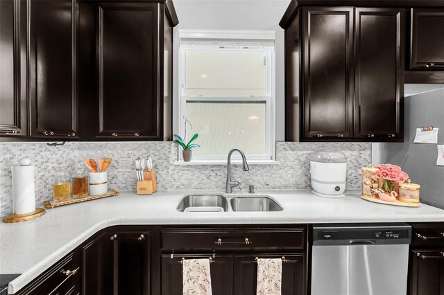 kitchen with dishwasher, tasteful backsplash, dark brown cabinetry, and sink