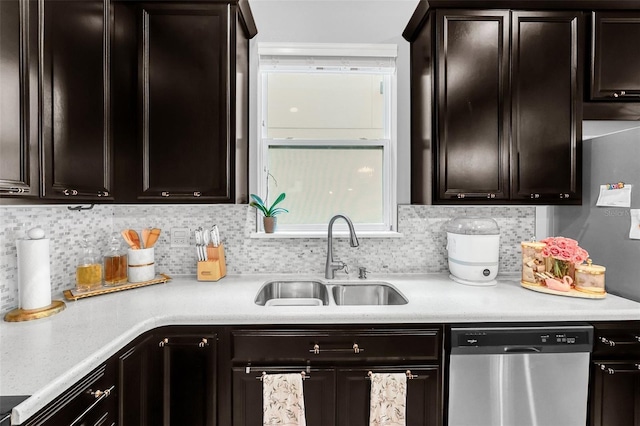 2599 Nouveau Way, Kissimmee, FL 34741 - kitchen with stainless steel dishwasher, light countertops, decorative backsplash, and a sink