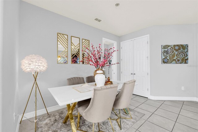 dining area featuring light tile patterned floors